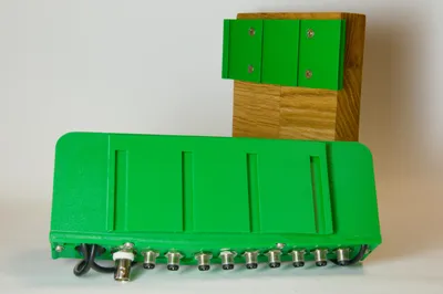 The Coltiva control unit's sliding mount: rails on the unit slide onto matching rails on an oak block.